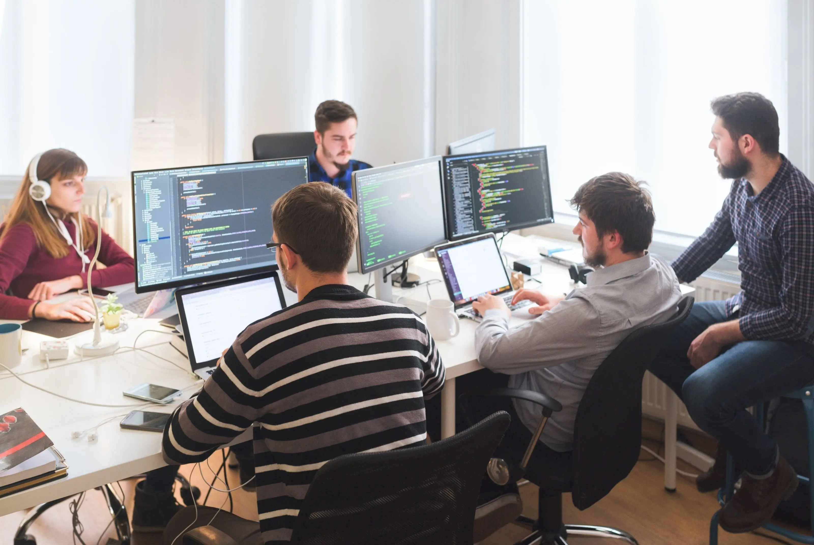 Technology professionals working together in a modern office