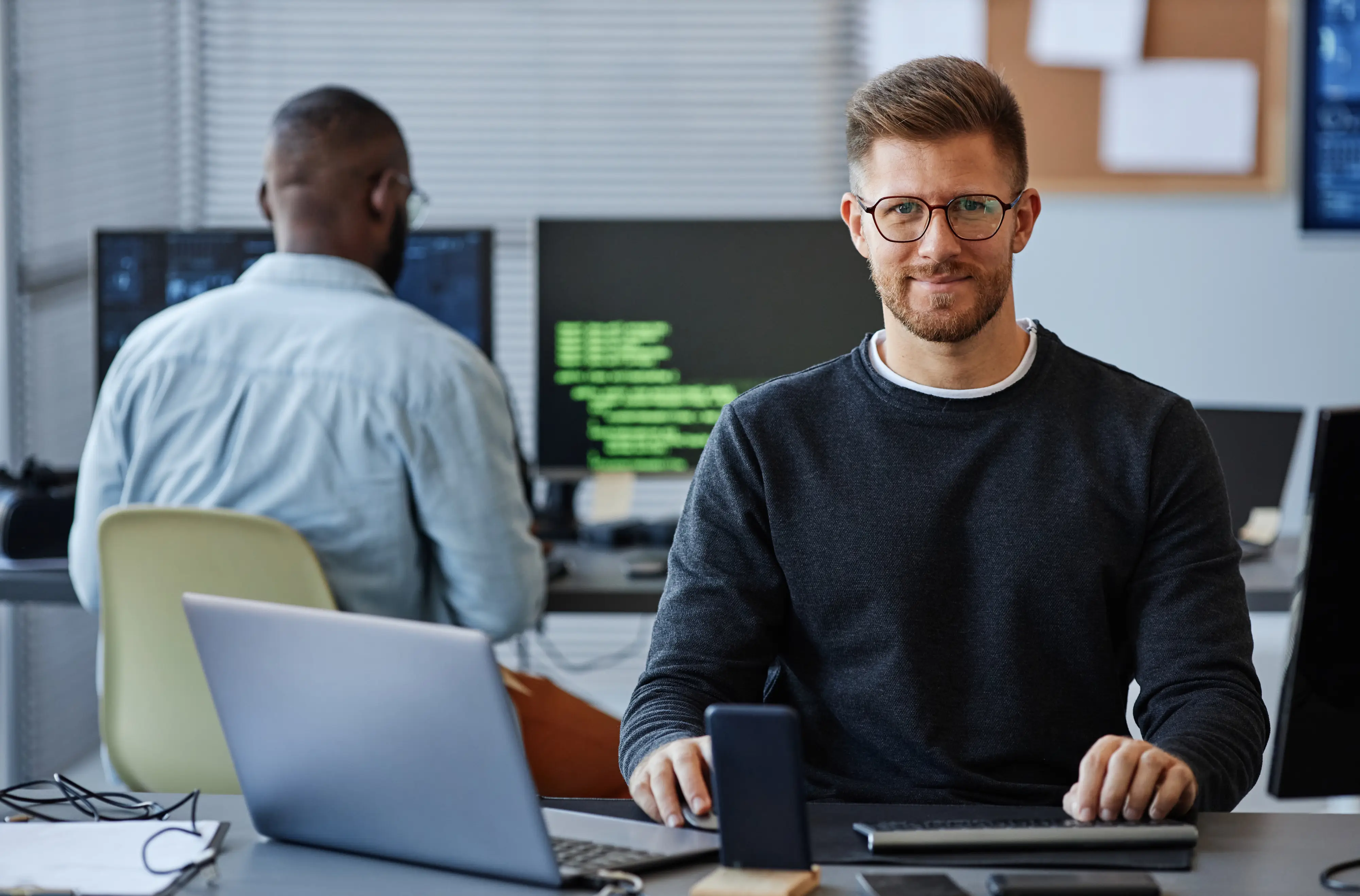 Cybersecurity professionals in a modern workplace